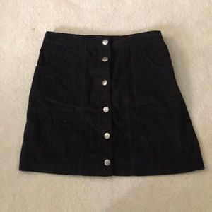 Black button up skirt.